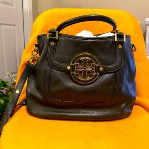 Beautiful leather bag with gold assessories with cross body strap.